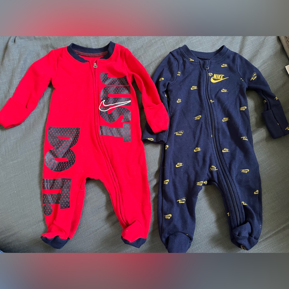 3 newborn Nike onesies